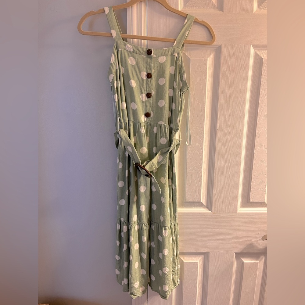 Green and white polka dot midi length dress